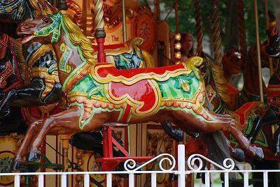 When a carousel is in motion, the movement of the carousel horse can best be described as a) a