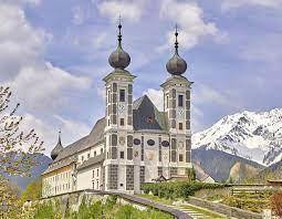 Why did the pilgrimage churches undergo large scale building projects