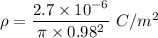 \rho =\dfrac{2.7\times 10^{-6}}{\pi \times 0.98^2}\ C/m^2