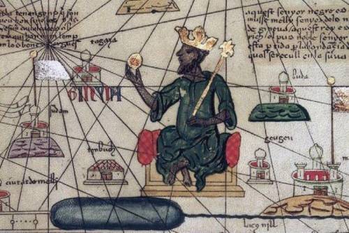 Who was Mansa Musa, and why might he have had a problem with his portrayal in the first photo? Help!