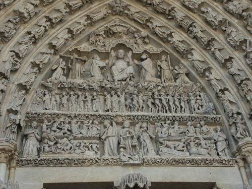 At what building can the image below be found? Sculptures of the Last Judgement on a gothic cathedra