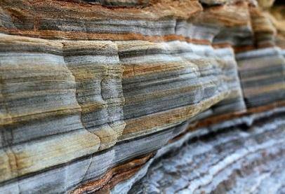 Which characteristic best supports its formation from sedimentary processes? It has many layers. It