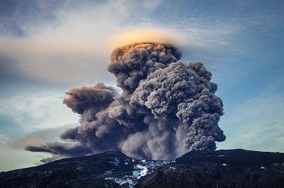 The image shows a volcanic eruption. Which statement best describes this eruption? This eruption is