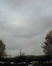 Stratus clouds, like the ones shown in the picture, look like large gray blankets hanging low acros