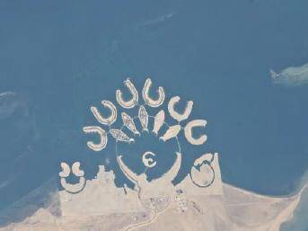 An aerial photograph of the Durrat Al Bahrain islands. The image above and the description below ar