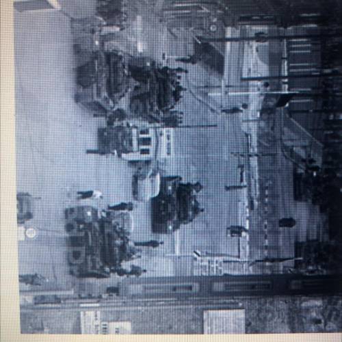the image shows russian and american tanks facing off at the east west berlin border on october 28,