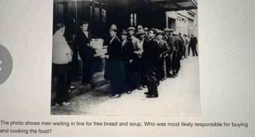 The photo shows men waiting in line for free bread and soup. Who was most likely responsible for bu