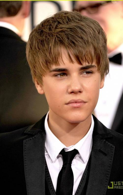 How old was Justin Bieber in the year 2001 and picture of him please . Thanks.